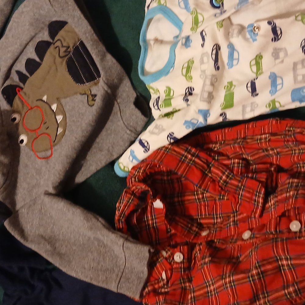 1 red,green and black onesie with long sleeves & buttons. 1